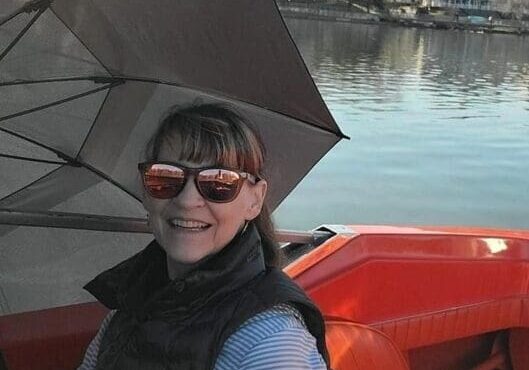 Woman enjoying a peaceful river view